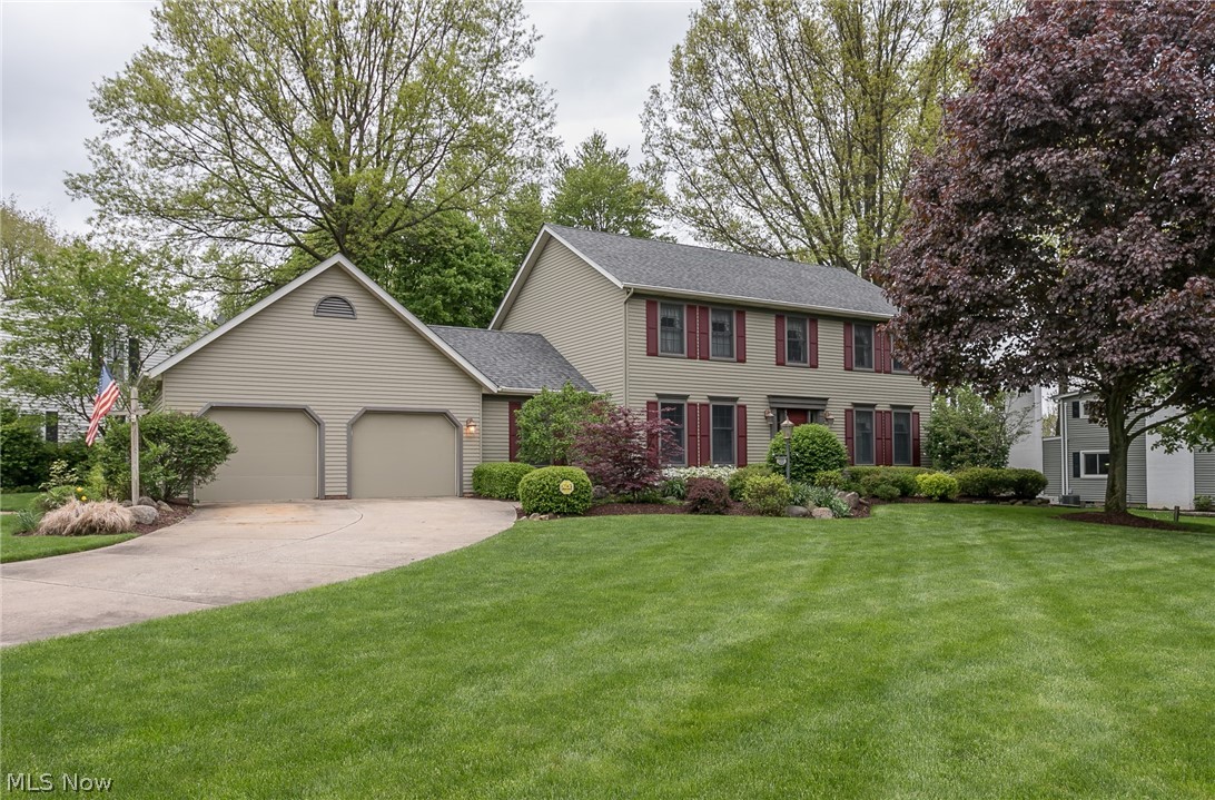 This Beautiful 4 Bed, 3.5 Bath custom-built Colonial (1988 by Wise Brothers) made-to-fit 2 corner lots in the desirable W. Twin Lakes (Kent, OH) area. The impressive architectural design w/ unmatched curb appeal boasts gorgeous landscaping and manicured lawn! Great location just 8-10 minutes fr. OH PIKE. Lake privileges & use of private Twin Lakes beach. Meticulously-cared-for by the only owners, you're greeted w/ all the extra touches that speak "quality": wide trim, crown moldings, dedicated office, granite kitchen, huge paver stone patio, extra-long front windows, central vac system, irrigation system & landscape lighting... & MORE! Great lower level Rec Room w/ bar & Full BA adds about 687 sq. ft. of living & entertainment space! Great home office on first floor with beautiful custom built-in desk & filing/storage is perfect for a work-from-home situation. Awesome vaulted Master Bedroom. Wood burning fireplace for those cozy nights at home in the family room. Wonderful basement st