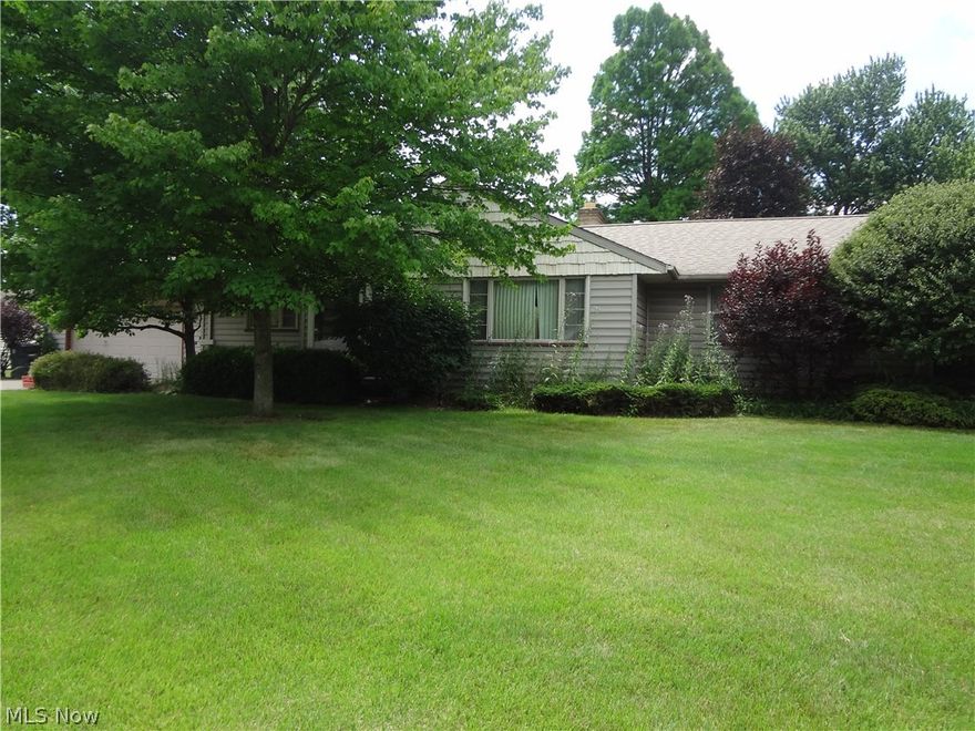 With some fresh paint and that personal touch this NE Warren ranch will be Home Sweet Home! Large combination living room with fireplace and dining room with built ins.  Eat in kitchen with a pantry closet.  Master bedroom with two closets and half bath with a wall of built ins.  The third bedroom is currently the first floor laundry. Hardwood flooring appears to be under all carpet. Enclosed back room has a gas fireplace for year round use.  Walk up attic, full basement, attached heated two car garage, and great location!