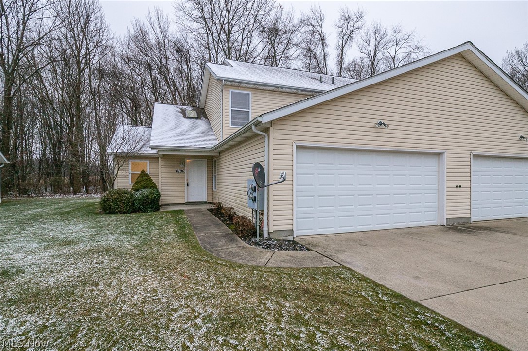 WOW! Move right in to this lovely 3 bedroom, 2 full bath condo in Rootstown. With luxuries of a first floor bedroom and full bath, and a first floor laundry, this unit also has brand new carpet, flooring in kitchen and baths, and paint. There have been other updates as well. There is an attached 2 car garage, patio, large closets, and so much more.