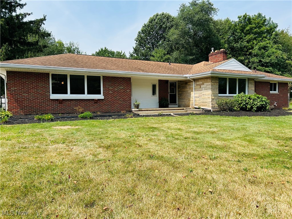 Step inside this spacious brick ranch and discover a home designed for comfort and style. The entire home has been freshly painted. It features 4 bedrooms and 2.5 baths, it boasts a large primary suite with vaulted ceilings, two walk in closets along with its own private full bath- making this your own personal retreat (new carpet, recessed lighting) Gather in the large living room with natural hard wood floors (that have been refinished), a cozy wood burning fireplace, perfect for Ohio's cold winter months. Or host fun family and friend game nights in the finished rec room, which also includes a second wood-burning fireplace. (Freshly painted, with new carpet) The upstairs family room offers even more space to relax and unwind, it features an electric fireplace, natural brick wall, (that has been newly whitewashed) a wet bar that doubles as a charming coffee station, (new sliding door, LVT Vinyl flooring, recessed lighting) and a bonus half bath; conveniently leading you to the kitchen that has beautiful (new LTV Vinyl flooring, natural stone counter tops, new sink and faucet, recess lights) perfect for cooking and entertaining. This home blends warmth, character, and functionality in every corner. Schedule a private showing TODAY!