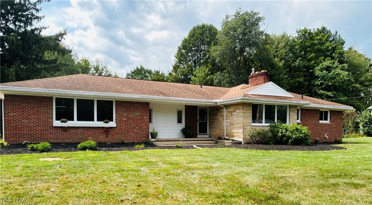 Step inside this spacious brick ranch and discover a home designed for comfort and style. The entire home has been freshly painted. It features 4 bedrooms and 2.5 baths, it boasts a large primary suite with vaulted ceilings, two walk in closets along with its own private full bath- making this your own personal retreat (new carpet, recessed lighting) Gather in the large living room with natural hard wood floors (that have been refinished), a cozy wood burning fireplace, perfect for Ohio's cold winter months. Or host fun family and friend game nights in the finished rec room, which also includes a second wood-burning fireplace. (Freshly painted, with new carpet) The upstairs family room offers even more space to relax and unwind, it features an electric fireplace, natural brick wall, (that has been newly whitewashed) a wet bar that doubles as a charming coffee station, (new sliding door, LVT Vinyl flooring, recessed lighting) and a bonus half bath; conveniently leading you to the kitchen that has beautiful (new LTV Vinyl flooring, natural stone counter tops, new sink and faucet, recess lights) perfect for cooking and entertaining. This home blends warmth, character, and functionality in every corner. Schedule a private showing TODAY!