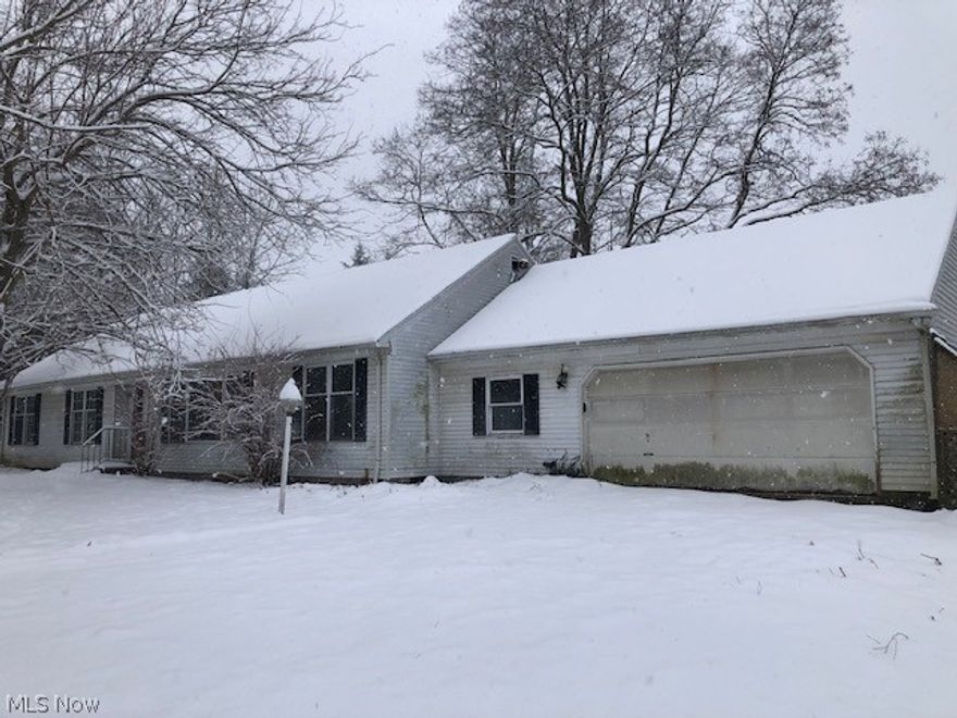 Take a look at this ranch home with over 2,000 square feet and on 5 acres in Auburn Twp.  This home offers four bedrooms, two-full and one-half bathrooms.  There is a front living room, dining room, kitchen with diniing area, large family room with fireplace and rear sunroom with many windows that overlooks the acreage.  The home has a two car attached garage and a partial basement with finish potential.  With the right finishings, this can make the perfect home!   The seller must comply with HUD Guidelines 24 CFR
206.125