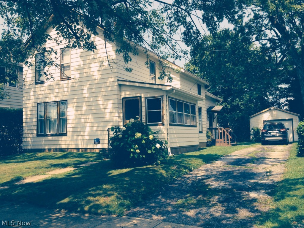 Well maintained Harbor 2 story, very neat and clean. Ample sized rooms mostly carpeted. Plenty of closet space and 1600 sqft of living space. Utility room up with bath combo. 50x150 lot size fenced in yard with single car detached garage w/ remote. Front sun porch, painted aluminum sided with new roof in 2005 and garage roof in 2013. Shows well!