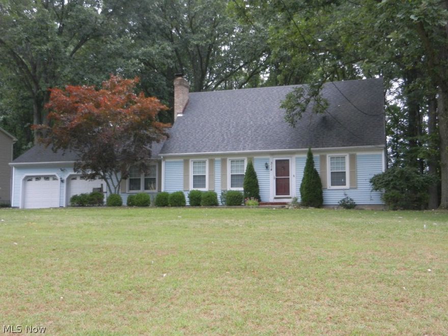 Lovely 4 Bedroom Cape, extraordinary in size and rooms, which sits on a wooded lot. A Stone's throw from the schools and Canfield Swim Club. See through wood burning fire place separates the Living and Dining Room. New Kitchen, raised panel cabinets with an bar height eating area. The wood floors have been completely refinished. There is a Large Family Room with Built in Cabinets by the fire place floor to ceiling. The gas fireplace was done by Youngstown Propane it has an over sized opening with a blower for heat and a light inside which features the inside fire brick background. There are French doors to the brick patio from the Family Room. 2 Bedrooms on the first floor and 2 on the second floor. There are French doors off of the Dining Area to the Sun Room. The Basement has a painted and carpeted area. Waterproofed Basement and walls with large anchors. 2 Car attached garage. All of the upstairs windows have been replaced. Security System.