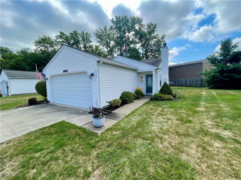 Tucked away on a peaceful cul-de-sac, this well-maintained 3-bedroom, 2-bath ranch-style condo offers comfort, convenience, and modern updates. The bright, updated kitchen features stylish cabinetry, newer countertops, and stainless steel appliances, flowing seamlessly into the open living and dining area. The inviting family room boasts a cozy fireplace, perfect for relaxing evenings. Additional updates include a newer A/C unit for year-round comfort. The home also offers a convenient laundry room with washer and dryer included. An attached 2-car garage provides convenience along with extra storage space. Enjoy your morning coffee or evening gatherings on the private outdoor deck. Ideally located close to tons of amenities and shopping, this condo blends privacy with accessibility for the perfect lifestyle.