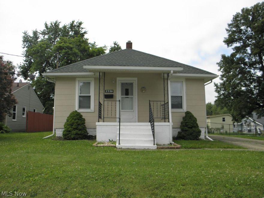 You'll be impressed with the care and condition of this clean, well maintained 2-bedroom ranch with 1-car detached garage located in the Ellet area of Akron. This home features a large Eat-In Kitchen complete with refrigerator, stove, an abundant amount of cabinetry, spacious counter tops, with eating area perfect for morning breakfast or nightly dinners. Need more dining area? Step into the formal dining room spacious enough for all your entertaining needs. Living room is at the front of this home and receives lots of natural lighting, step out onto the covered front porch for enjoying the evening summer breeze. 2 nicely sized bedrooms separated by the large Jack and Jill full bathroom complete one floor ranch style living. Basement is clean, has glass block windows, laundry area, a small workshop setup with room for storage. Outdoors, enjoy the covered back porch and ramp access if needed. Central air, newer roof, washer and dryer, 1-car garage and paved driveway make this home one y