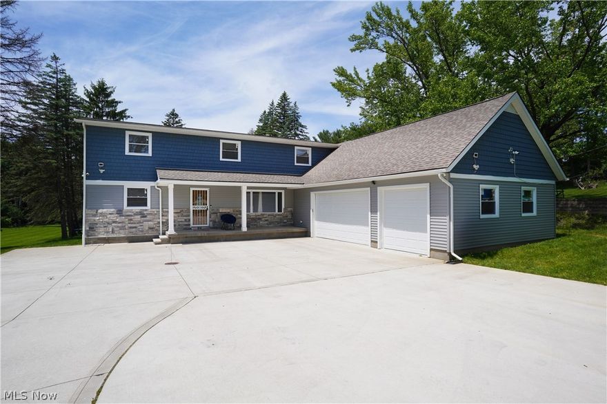 7460 N Meadowpark Dr in Walton Hills, Ohio 44146 in the Bedford School District on over an acre of land! This home was taken down to 3 walls and the studs with a large addition and garage addition in 2019! The effective date of the home is 2019 due to the cast new construction and remodel in 2019. The beautiful layout lends well to a multigenerational living with the 1st floor bedroom & en suite full bathroom and 5 additional bedrooms on the 2nd floor with 2 full bathrooms, one is an en suite for the Primary Bedroom and Primary bathroom! The home has a HUGE open concept 1st floor living including a 30 plus foot Living Room and Kitchen! There is BOTH an informal dining area that leads to the rear deck as well as an actual Dining Room or use as an at Home Office near the front entry door! There is also a gorgeous granite Island fit for a queen, king & their family! This layout is PERFECT for large gatherings, entertainment or simply for serene peacefulness! There is an additional 2nd full bathroom on the 1st floor as well as laundry room as well as another oversized lower level basement bathroom since there is a Bonus Room being used for the bunk beds. Additionally, the lower level has a huge Recreation Room, Bar Room for entertaining & mechanical room for 1 of the 2 HVAC systems. The 2nd floor is home to 5 bedrooms, 2 full baths & additional informal media room for separate areas of home media, gaming or homework area! The rear deck is 2 large sections overlooking the huge rear yard that has both a level grassed area for games and a treed area for your enjoyment! The 3-car garage is oversized and has a 2nd electric panel with room to expand & pulldown stairs for access and high ceilings for plenty of storage! This home was designed for the flexible living that this home offers at an affordable price! The updated lighting is easy on your budget and the vast concrete driveway gives great parking for all of your guests as well! Home warranty included for peace of mind!