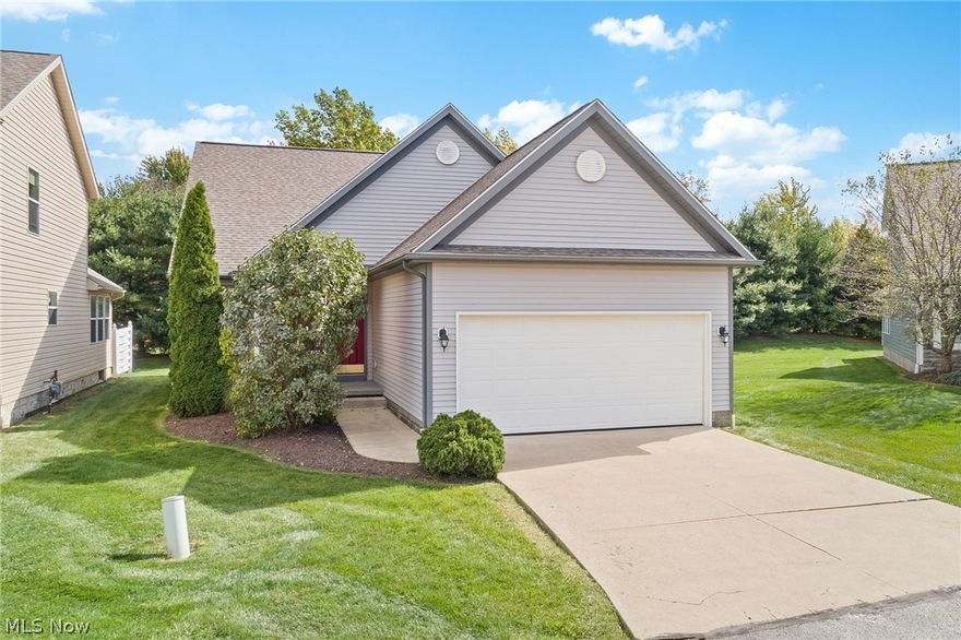 Maintenance-free living close to Kent State University and a short drive to Rt. 76.  This home has been lightly lived in and well cared for with newer carpet throughout and professionally cleaned every month. A welcoming front porch leads inside to the family room which boasts a gorgeous stone fireplace and vaulted ceilings. The kitchen is the heart of the home with newer appliances with island seating and open to the dining and living areas. Plenty of room for entertaining. Enjoy your newly renovated sunroom all 4 seasons with access to the private back patio. The owner's suite is on the main level with a spacious walk-in closet and an en suite featuring dual vanities. The first floor laundry is just in from the garage and in close proximity to the half bath. Upstairs, you have a modern loft space overlooking the main living area and allows great flex space for a playroom, office area or an additional living area. Two bedrooms and a full bath complete the second level. A full basement