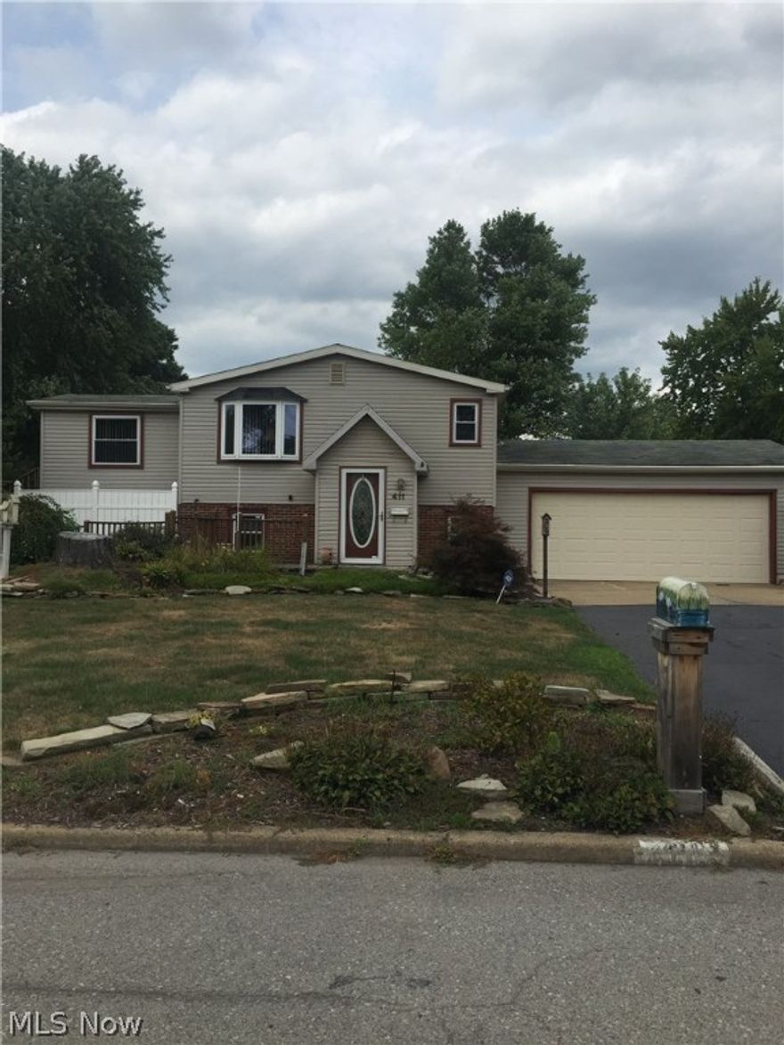 Wonderful 3 bedroom home featuring updates to main bath 2007, carpet in 2010 and 2012, kitchen appliances 2007, washer/dryer 2009. H2O 2012. Boiler 2006. AC 1997. Garage door 1999 and opener 2012.  Newer windows in 2008 Except laundry room.  1st floor living room with gas fireplace and dining area with electric fireplace.  Rec room with additional fireplace on lower level. 2 car garage. Home sits on a double lot with multi-tiered deck and spacious yard. 3 sheds on property for ample outside storage. 
Niles mailing and utilities. Howland Schools.  Home DOES NOT require flood insurance.
Land Contract terms: $10,000 DP , 6% interest ,2-3 years.