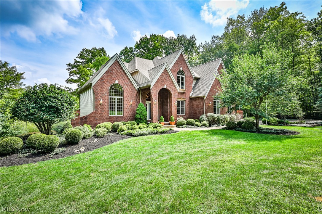 Stunning custom built colonial on almost 3 acres which is adjacent to the Geauga Nature Preserve on 2 side of the wooded lot providing your own sanctuary. 2-story foyer with open staircase and gleaming Brazilian Cherry hardwood flooring, formal dining room, plus extra living area off of the well appointed kitchen offering an island, breakfast bar, octagon eating area, granite counters, and spectacular porcelain flooring imported from Italy, all appliances remain. 1st floor laundry room, with washer/dryer, first floor powder room, and spacious office. Upper master bedroom and bath has jetted tub, marble counters, double sinks, and 2 walk-in closets. Guest room with full bath and two additional nice sized bedrooms are located upstairs with a Jack & Jill bath, carpeted bonus room perfect for game room or play room. Partially finished large walkout basement with plenty of storage and workshop space, ready with plumbing and electric. Home is equipped with whole house vac system, Kineti