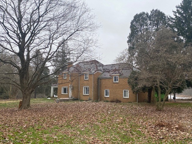 Lakefront brick home on over 30 acres in Columbiana! (Yes you read that right!) First time offered in 70 years. 30 acres of prime development opportunity plus a 4 bedroom brick home just begging to be remodeled. Lots of lake frontage. Private location--most people drive by it and don't know it's here. Call us today for the specifics on this property. Owner has replaced roof and is having city water/sewer ran to the house.