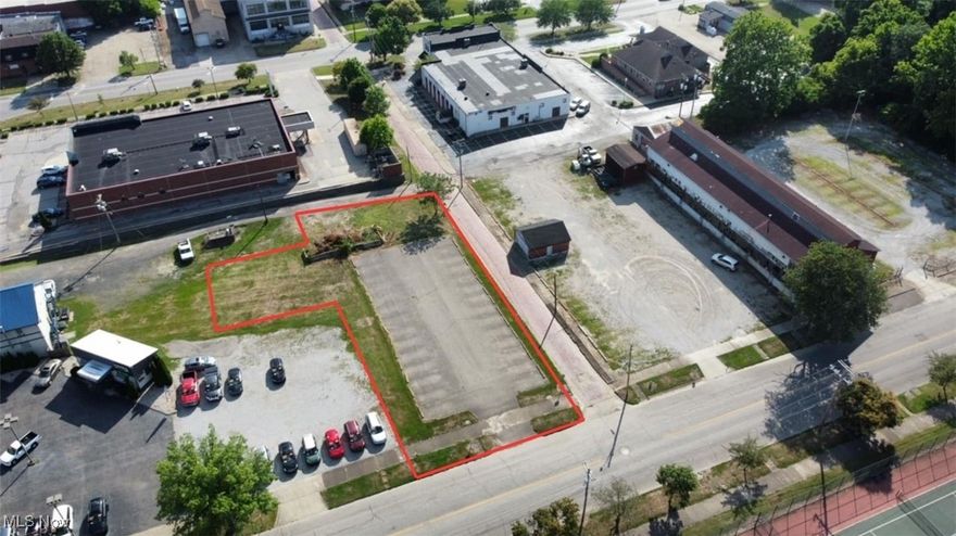 Zoned C4, located within the 100 year flood plain.  Site large enough to have a commercial building and still have sufficient parking. Good visibility and good access from 4th Street with one curb cut.  No curb cuts or access off Church Street. Rear of property is accessible from public alley.  Subject site consists of two platted.  Front lots is 240004608000 and has all the road frontage, side lot is 240004612000 and has no physical road frontage. Currently provided 7400 of asphalt paving on the front lot that provides striped parking for 28 vehicles.  Side lot is undeveloped and has no improvements.  Certified Appraised.