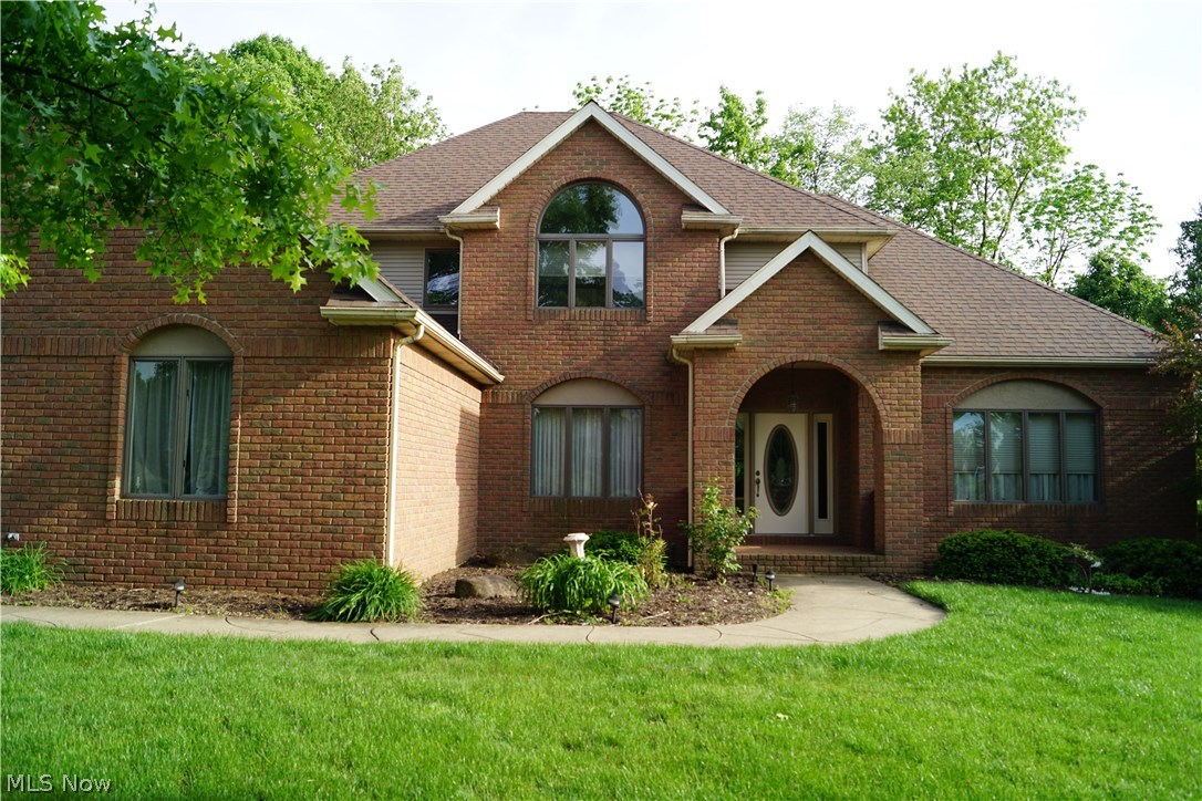 Welcome home to your new custom built Jamestown home in highly sought after Williamsburg Estates! This meticulously designed home features an open layout design that flows from the exquisite chefs’ kitchen complete with granite counter-tops, island and ceramic tile floors to a beautiful great room with 17' ceilings accented with a massive floor to ceiling brick fireplace and two towering windows on each side! Enjoy your huge first floor master bedroom that has 10'ceilings with crown molding, brand new hardwood floors, his and her walk-in closets and master bath with a double sink, tub and shower! Walk upstairs to 3 additional bedrooms, a full bathroom, loft area and gorgeous view overlooking the great room. The dining room is not to be overlooked as it is opened with beautiful wood trim and plenty of room for entertaining. On the main floor this home also features two half baths, mud room, laundry , wet bar, and walk out kitchen to an amazing maintenance free Trex deck with warranty an