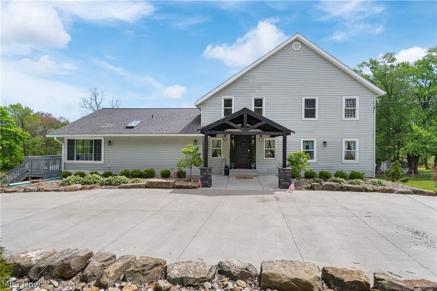 This stunning 5 bedroom century home offers the perfect blend of historic charm and modern luxury. The open-concept layout features soaring vaulted ceilings and an oversized kitchen equipped with a large island, coffee bar, and custom recessed lighting—ideal for everyday living and entertaining. The main floor primary suite includes a spa-like en suite bath and overlooks a serene covered back patio. A newly finished sunroom provides a cozy space for year-round enjoyment, while the upstairs boasts 4 spacious bedrooms and a full bath. Downstairs, enjoy movie nights in the recently completed theater room with rustic rough-cut lumber walls. Outside, the property spans 8 picturesque acres with a pond, mature apple and pear trees, and thriving blackberry bushes. Newly built 2-stall horse barn and fenced pastures create the perfect setup for horse enthusiasts. Bridle trails conveniently located just down the street from Silver Creek Metropark for easy trail riding access. The 8-car heated and cooled garage includes a car lift, office and restroom—perfect for a workshop or home business. Contact your Realtor for a complete list of updates & to schedule your private showing.