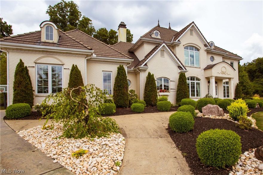Exquisite Modern Brick Home Located at the End of a Cul-de-sac. Enter into a Breathtaking Foyer featuring Versailles Parquet Old World Flooring and a Chandelier that is second to none. This Foyer is flanked by an Amazing Formal Dining Room, Office and Marble Staircase. Beyond the Foyer on the Main floor is an Elegant Living room that features a 10' Tartaruga Gas Fireplace. Natural lighting throughout the Master Suite featuring a Master Bath (7 head Kohler power tower) and Walk In Closets. The Spacious "Chefs Dream" Kitchen Adorned with Beautiful Cabinetry features Wolf Appliances which include Dishwashers, Double Oven, Gas Range, and Refrigerator. Upstairs there are 3 additional Bedrooms which include Walk In Closets, A Grand Family Room, Theatre Room, and 2 additional Baths (1 Bath and Bonus room off of the Right Wing, and a Jack and Jill Bath between Bedroom 3 and 4). This Entire Home has been fully finished with Crown Molding and Matching Accent Plates on all of the Switches and Outlets, Updated Unique Light Fixtures throughout. At the Back of the Home within the Newly Fenced in Yard, You will find a Private Patio Perfect for Entertaining or Relaxing in the Jacuzzi Hot Tub. Included with this Home is an Inground Electric Fence and 3 collars. Basement is currently unfinished but could Easily be Finished for even More Living Space. Don’t Miss Your Opportunity to Own this Strikingly Unique Home.