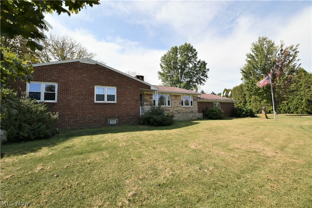If peace and quiet is what you are looking for in a new home than this is what you have been searching for. Original owner/family offering this three bedroom brick ranch with sandstone accent on 3.8 beautiful and serene acres of land. Perfect for hobby farm or someone wanting to still live in the country but scale back from large farm.You will be welcomed into a bright and spacious living room with large windows offering plenty of natural sunlight. Hardwood floors throughout along with black walnut trim work. The oversized dining room with double sided fireplace offers an abundance of space for large family dinners and entertaining. The kitchen offers an attached dinette. There are three generous sized bedrooms with cedar closets and full bath with built-in drawers for storage. The basement offers a workshop area along with a second kitchen perfect for canning. There are vinyl tilt-in and glass block windows. 220amp service available in the garage. Enjoy gatherings on the rear