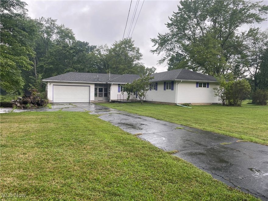 Exceptional 3 Bedroom 2 Full Bath 1728 SF 2 Car Attached Ranch with 2.3 Acres (5 Parcels) on very quiet street.  Additional small block bard and additional freestanding 2 car garage.  Master suite addition with slider and walk out deck.  Family room with slider and walk out deck.  Breezeway to 2 car attached garage.  Full basement with stair entrance and fruit cellar.  Lots of room for shop area.  Roof appears newer.  Excellent piece of property west of downtown Newton Falls.  Portage County, Southeast LSD.  By order of Heir.