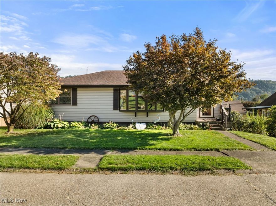 Welcome to this charming 3-bedroom, 1.5-bath home nestled in a beautiful neighborhood in Brilliant, Ohio. This well-maintained property offers comfort, character, and plenty of space to make it your own. Enjoy stunning views—including the bridge—from the huge back porch, perfect for relaxing or entertaining guests. Inside, you’ll find hardwood floors, a large bay window that fills the living room with natural light, and a finished basement with a rec room for extra living space. The roof is less than 10 years old, and the home also features an attached garage for convenience. A true gem combining small-town charm with modern updates—schedule your showing today!