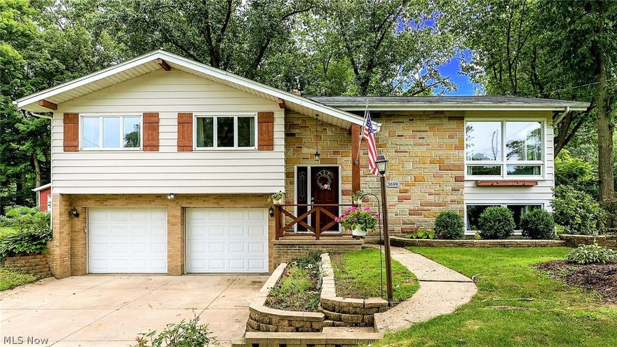 *Beautiful Bi-Level In Green LSD Features 2,380 Sq. Ft Of Finished Living Space Including 4 Bdrms, 2 FULL Bathrms, Finished Lower Level + BONUS Rm Off Of An Attached 2 Car Garage! *Park Like Setting ~ Enjoy .84 Acres Of Land From A Double Tier Deck, Or Sit By The Firepit ~ Mature Trees For Shade, Raised Bed For Garden, Ravine W/Stream Behind, Tree Lined Side Yard To The East For Privacy On A No Outlet Street! *Walk In To A Foyer W/12' Ceiling & Stunning NEWLY Refinished Hardwood Floors Throughout! *Living Rm W/VAULTED Beamed 12' CEILING, Fan & Tall Triple Corner Windows *Elegant Dining W/Chandelier & Triple Windows *New Updated MODERN LUXURY Kitchen W/Grey & White TILE Flooring, White Shaker Style CABINETS W/Soft Close Drawers, Sparkle GRANITE COUNTERTOP W/Breakfast Bar, Mosaic TILE Backsplash, Recessed & Double Pendant Lighting -> Fully Applianced W/SS Whirlpool Refrigerator, Oven, Dishwasher & Microwave! *Full Bathrm Main Floor W/Rustic Luxury Plank Flooring, Glass Tile Vanity Backsp
