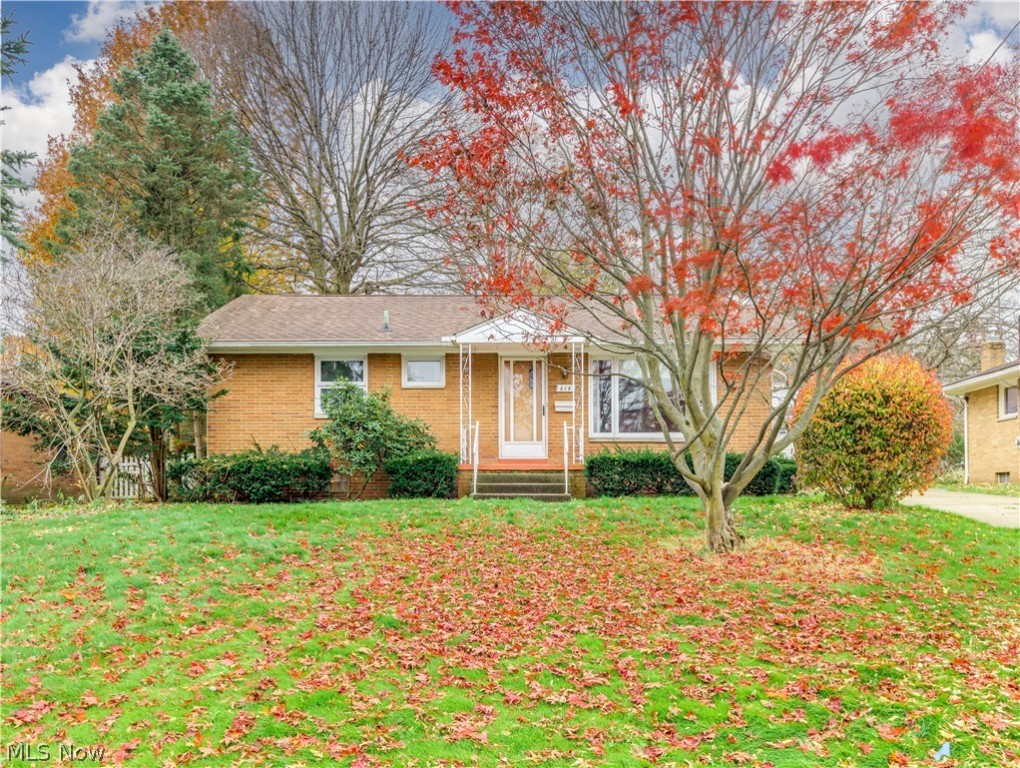 Welcome to this charming, well-maintained brick ranch home on Barberton. Enter the spacious living room and notice the modern colors and newer flooring throughout most of the house. The eat-kitchen offers appliances, plenty of cabinet space, a beautiful tile backsplash, and a dinette area. There is a convenient half bath off the kitchen and the family room. The lovely family room has a wood-burning fireplace-raised hearth, and it leads you to a glass-enclosed sunroom with access to the patio & private fenced-in backyard, perfect for the kids' and pets safety. Two bedrooms, built-in drawers in the hallway, and a full bath with a large countertop complete the main floor. Downstairs (basement) is very clean, dry, divided, and easy to get finished as a living space, plus a large laundry room with a big utility sink and plenty of storage space. Concrete driveway to a detached two-car garage. Close to hospital, Tuscarora park, and shopping. Some updates include a water heater (2021), a dishw