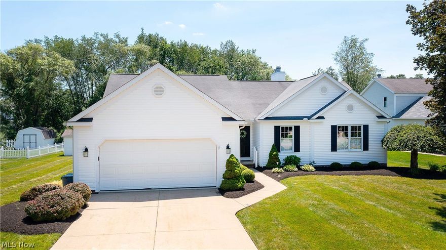 Beautiful all-in-One Floor home in the excellent North Canton school district. This Immaculate ranch has a great layout that flows throughout this home and offers 1,900 SQ FT of living space. Enter the welcoming open foyer with hardwood floors, and to the left is the formal dining room with chair rail. The great room has a vaulted ceiling, a gas fireplace with a lovely stone surround & wood mantle, and modern colors. Enjoy the eat-in kitchen with plenty of cabinets, appliances, recessed lights, a pantry, and a dining area with sliding glass doors that take you out to the deck overlooking the backyard, perfect for entertaining and relaxing. The master suite is spacious with a vaulted ceiling, a nice walk-in closet (5x11), a master bath with a double sink vanity, jetted tub, and a walk-in shower. Two other bedrooms, a full bath, a convenient first-floor laundry (with utility sink), and a dropoff area with a large double door closet off the garage, complete the main floor. The clean, dry,
