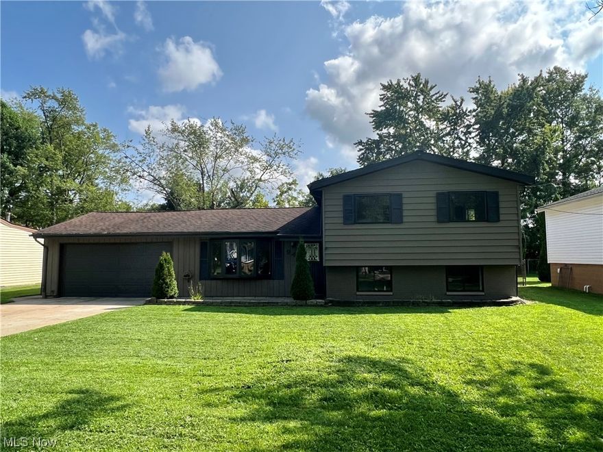 STUNNINGLY UPDATED NORTHFIELD SPLIT LEVEL !! THIS HOME IS A MUST SEE. WELCOME HOME to this BEAUTIFULLY UPDATED 3 Bed  2.5 Bath GEM !
Located on a quiet street in Northfield near shopping, parks and the highly sought after Nordonia school district !! Enter to find a spacious Living room with large bay window allowing tons of natural light to flow in. The modern styled kitchen is equipped with a large SS fridge, gas range, built in microwave, 
SS Dishwasher and large single bowl SS sink. Access from the kitchen to the garage makes stocking groceries a breeze and the slider off the dinette provides 
easy access to the covered rear PATIO and backyard. There's also a window over the sink to keep an eye on the kids or feel close to the party while entertaining. 
Upstairs you'll be amazed to find 3 LARGE bedrooms with plenty of closet space, a beautiful main bath with a NEW tub and tile surround, HUGE MASTER with 
EN-SUITE. The master bath is equipped with a gorgeous tile shower stall ( Shower enclosure on order and installed asap). The bedrooms, hall and steps are adorned with BRAND NEW super SOFT carpeting. Vinyl wood look flooring in basement leads to the half bath for quick access without taking off shoes, relax or entertain in the cozy carpeted family room section of the basement. NEW VINYL WINDOWS in the upstairs bedrooms, basement provide easy use, cleaning and Natural gas HOME GENERATOR, 90+ furnace, new A/C provide peace of mind for years to come. Enjoy YOUR SHOWING !!