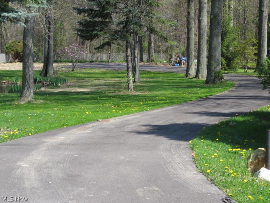 Build your dream home on this beautiful wooded lot in desirable Hubbard Twp. neighborhood. Apx. 1.5 acres with all public utilities and beautiful spring fed pond dug by team of oxen in 1800's. Lot has existing paved driveway and landscaping.