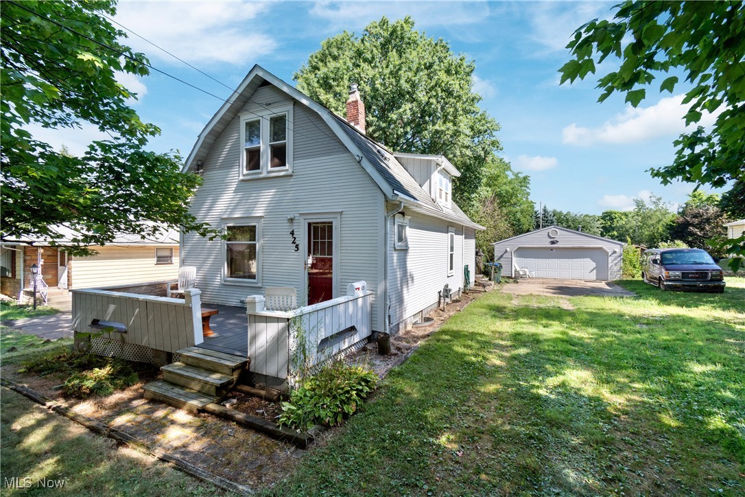 Welcome home to 425 Loomis Ave in Cuyahoga Falls. This property is located within walking distance of Downtown Cuyahoga Falls yet tucked away on a dead-end street. The home features a huge almost 1/2 acre lot with an oversized garage and multiple sheds/outbuildings. The garage is a huge including a wood bench, heating and plenty of working space. The house would require work but offers tons of possibilities. The home boasts roughly 1000 square feet, two bedrooms and two full baths. The lower level features two living space: family room with wood burning stove & full bath. The first floor also includes kitchen, formal dining room and living room space. Upper level includes two bedrooms and second full bath. Lower level offers plenty of storage. If you are looking for a home to update and make your own, this property is it! Call/text for your private showing today!