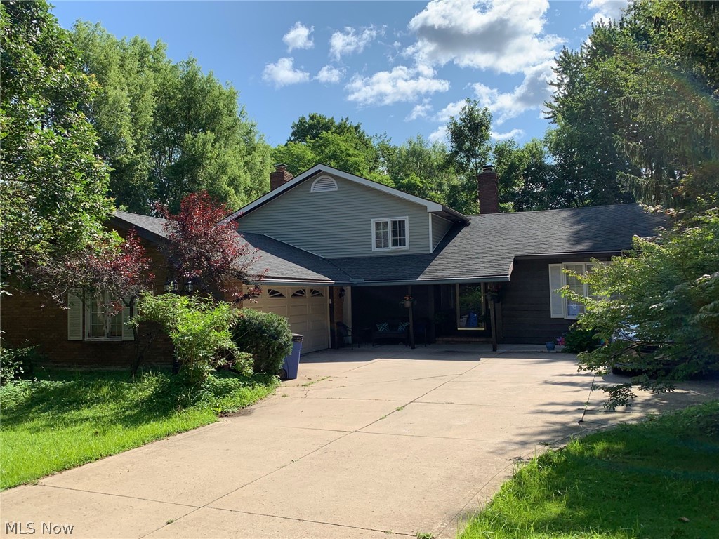Get cozy in this completely refurbished four-level home, which is located in the beautiful Village of Gates Mills. This split-level home is uniquely and stunningly custom designed. A grand Living Room with vaulted ceilings sits adjacent to an impressive Dining Room that includes a large picture window, designer's panels and beautiful flooring. The updated Kitchen is equipped with a newer refrigerator, dishwasher, cook top, granite countertops and double oven. Sliding doors lead from the Kitchen to a conveniently shaded patio, which overlooks the appealingly private back yard. Additional access to the back yard is located off of the Family Room. A charming fireplace (with blower) efficiently heats the entire house, allowing for significantly lower gas bills during the winter months. The Master Bathroom is uniquely equipped with a fully-functional bidet, along with a modern shower cabin that includes a built-in radio. The second bathroom includes a Jacuzzi tub for your relaxation needs.