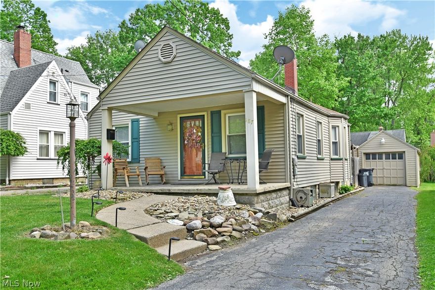 This adorable Boardman cape cod is ready for you! Welcome to 187 Maple Drive! As you enter the property, beautiful landscaping and a large covered front porch offer a warm welcome. Step inside to a large living room with low maintenance, wood look laminate flooring flowing throughout the first floor and tons of natural light. An updated eat-in kitchen is just beyond the living room and features updated cabinetry, bay window eating area, and stainless steel appliances which remain! Two nicely sized bedrooms with ample closet space join an updated full bath to complete this level. Upstairs you will find a sprawling bedroom with loads of storage. The basement is home to laundry services, plenty of storage, and room for plenty of other ideas! The backyard is perfect for relaxing on your paver patio. The yard is fenced making it perfect for kids and pets alike! Don't wait, call today for your personal tour! **Updates: Furnace and AC (7/20) Sump Pump 2020, Electrical panel replaced 2021, Lam
