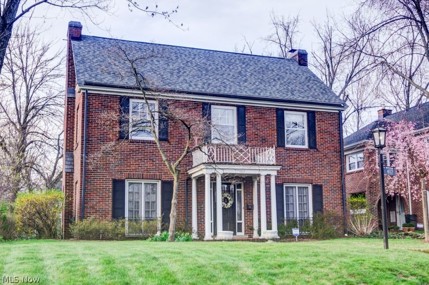 This stunning brick colonial in beautiful Ridgewood has all the charm you'd expect from a historic home. The spacious yard features spanning hedge rows, a canopy covered brick patio, well manicured landscaping, and a two car garage. Upon entering the impressive foyer with eye-catching staircase, you'll fall in love with the beautifully maintained original hardwood floors that can be found throughout. The living room boasts two opposing French doors offering a comfortable summertime breeze, an elegant white marble gas fireplace with a large mantle, and original crown molding. A third French door in the sizable dining room allows you to bring the outdoors in. You'll find a convenient half bath off the bright, remodeled kitchen. Upstairs, an inviting landing and hallway leads to three excellent sized bedrooms, a full bath, a walkout balcony overlooking the back yard, and a large attic. Updates includes newer radiant heating unit, central air conditioning, a replaced roof, and much more. M