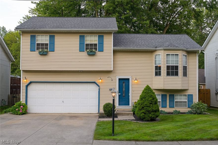 This exceptionally maintained home boasts a open concept living area with cathedral ceiling in the living room, dining room & kitchen. Directly off the dining room is a large sun room that leads to a multi-tiered deck and patio with fire pit. You will enjoy the beautiful fenced in back yard.  The huge lower level family room is complimented by a stone fireplace and has direct access to the back yard as well.  Welcome Home.