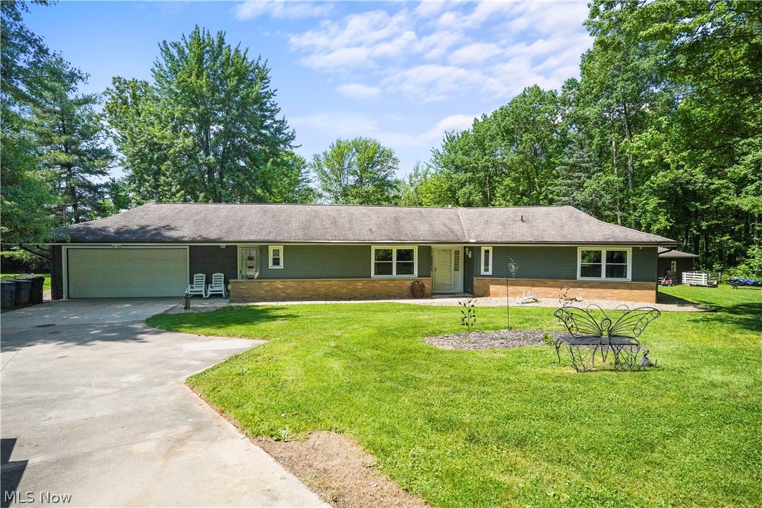 Ranch home with over an acre of gorgeous property! Sits up against The Metroparks. Picture perfect backyard with patio where you can sit out and entertain or enjoy the deck and above ground pool to cool off in the summer. Surrounded by woods for privacy. Home offers so much! Great room, Living room with built in fireplace, newer carpet in great room(2022). Dining room open to the bright kitchen offers plenty of cabinets for storage, and all appliances included. Master bedroom includes private bath. Room currently being used as an office could be used as another bedroom. Two car attached garage, new garage door (2022). A/C and furnace (2020), HWT (2021). New siding and garage window (2023). Long concrete driveway with turnaround. Close to schools. Ready to move right in!