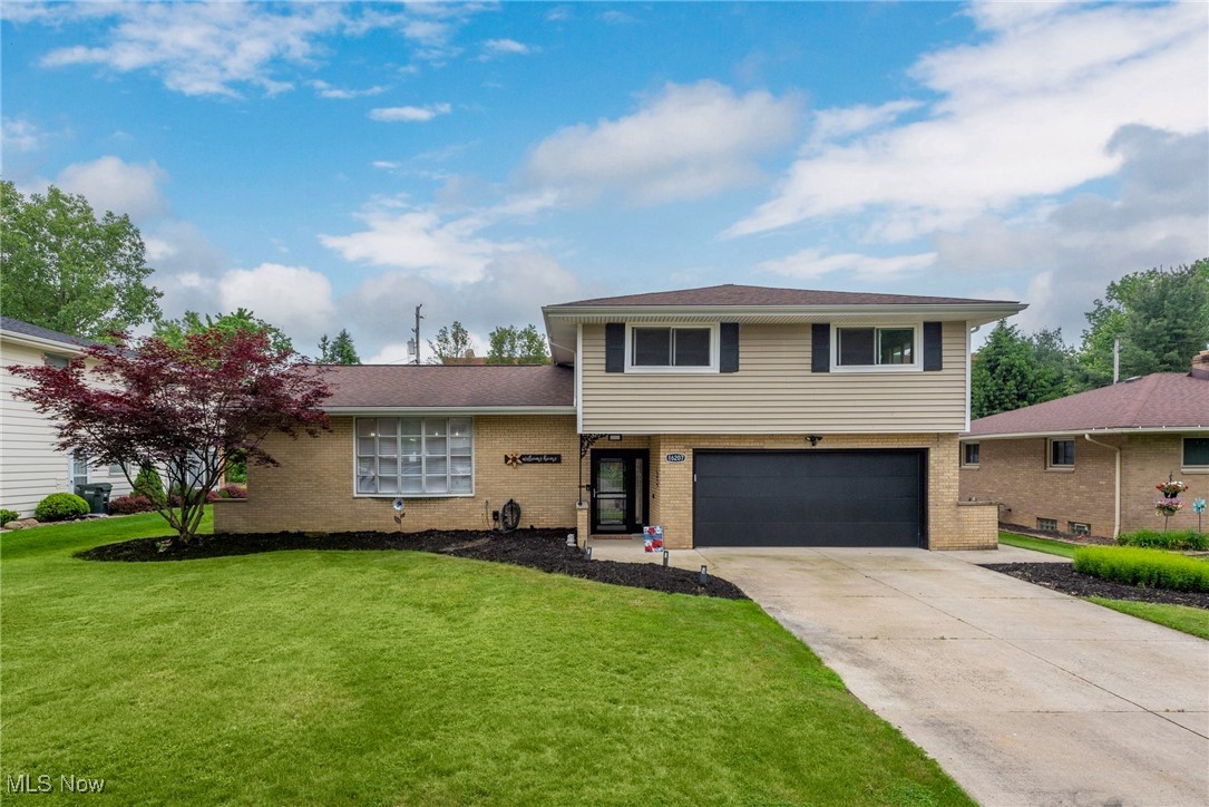 Simply stunning! Come see this beautifully updated 4 bed 2.5 bath split level located in a desirable Middleburg Heights neighborhood. This must-see home boasts a large open concept floorplan perfect for entertaining. Warm hardwood floors found throughout the home lead you into a chef's kitchen that features a large custom island, Ultra Craft cabinets with undermount lighting, quartz counters and a glass tile backsplash. An upgraded stainless steel KitchenAid stove, microwave and dishwasher complete the space. Moving upstairs you'll find the large primary bedroom with en suite bath(updated 2025) and 3 additional bedrooms with separate deco full bath. Heading downstairs to the lower-level family room your welcomed with LVL flooring, a wall mount fireplace and updated guest half bath. The partially finished basement offers space for a game/playroom and laundry area. Attached, the 2-car garage has epoxy floors, additional storage space as well as an updated door and opener. Moving out to the back yard a sizable 3-seasons room and concrete patio offer space for summer entertainment and a newer shed welcomes a garden lover. Additional updates include new Furnace and HW tank (Feb 2024), carpet and paint, newer roof, siding, windows, gutters, insulation, electrical panel, glass block windows, front door, and much more. Pride of ownership shows throughout.