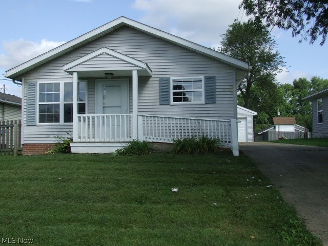 One floor living in this modified Barberton ranch. New laminate floors in living room and bedrooms. Large eat-in kitchen with appliances, with door to access the detached garage from the driveway. Closeted laundry area in kitchen for convenience. Bathroom has been modified for handicap accessibility, walk-in 3x5 accessible shower with seat and grab bars and hand held shower head. Wheelchair friendly sink and toilet with grab bars, ceramic tile floor. Extra large doorway designed to accommodate wheelchairs/walkers. Ramp from paved drive to front door, no steps. New interior paint, with vinyl siding exterior. Flat back yard. This low maintenance home is clean, well maintained and move-in ready!