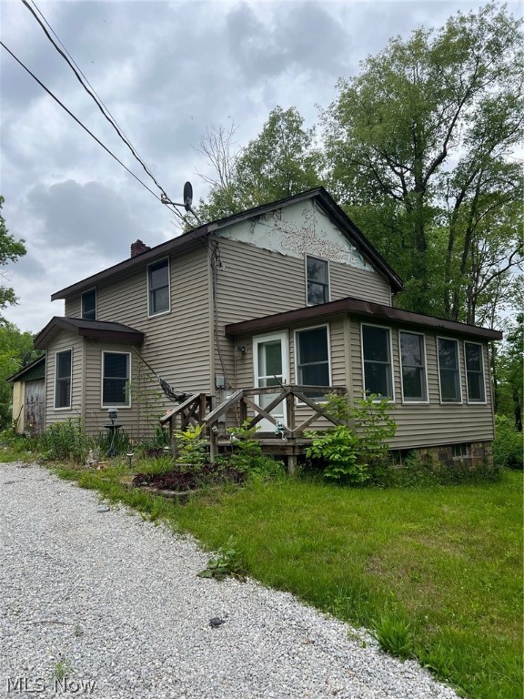 looking for a home that is secluded like no other in Ravenna? Look no further than this property located at 5933 Lakewood Rd. This property sits way back off the road with no neighbors even visible from the house. The property features over 37 acres of property and sits on parts of breakneck creek and its overflows. There are many opportunities for wildlife lovers, or hunters with plenty of deer, turkey, fish, etc. You would have to come see it to believe it. The home that sits on the property was built in 1920 and is a cape cod style house that features 1080 sq.ft. of living space, kitchen with appliances to stay with the sale of the home, nice sized living room, dining room, and large enclosed porch. They have converted the whole upstairs into one large master suit that includes a bedroom, bathroom, and laundry room. The outside of the home does need some repair as they started to side the home but was never completed, however the new siding is in the garage. There is a 40 X 48 pole building that is in very good shape and includes 3 garage doors and concrete. This is a home that is looking for someone to appreciate all this property has to offer. Come take a look and see for yourself.