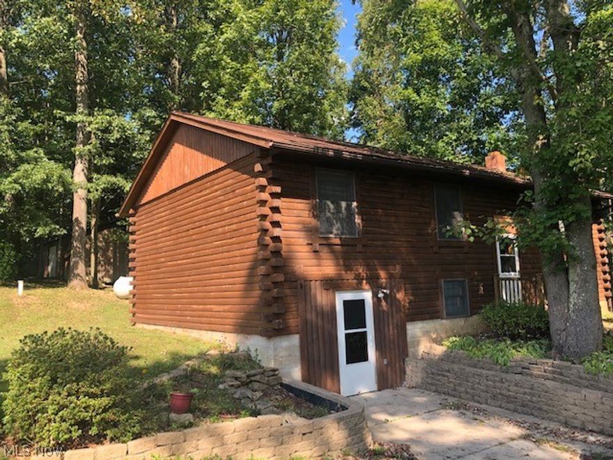 First time to be offered on the market!  The warm, honey-hued logs will make your family feel relaxed and guest at ease.  Now is the chance to make this 3 bedroom, 2 bathroom log home  on 2.5 acres your own.  The location is great to feel rustic yet an easy drive to town.  Salt Fork is just a few minutes away for outdoor activities and boating.  Walk out basement, detached garage, pole barn, storage barn. This property has been well cared for and offers a move-in ready home!