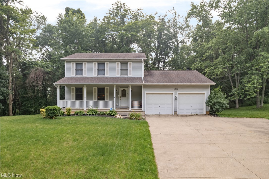 Gorgeous 3 bedroom, 2.5 bath colonial on 1.19 acres in Green! Plenty of living areas including a finished lower level! Hardwood floors throughout the main level. Fully applianced kitchen with a pantry, Corian counters and a center island with seating! It opens to the dining room with a bay window. Gather in the front living room or in the back family room boasting a fireplace and doors to the covered back deck. Convenient half bath plus laundry hookup on the main level - washer and dryer convey! Upstairs, there's updated carpet in the bedrooms. The master suite has 2 closets and a private full bath with a Jacuzzi tub and a tiled walk-in shower. There are 2 additional bedrooms and a full bath. Tons of extra living space on the finished, walkout lower level with a huge rec room, reverse osmosis and plumbed for a full bath. Walks out to the back patio. Relax on the covered front porch and a covered back deck with skylights and beautiful wooded views. 2-car attached garage plus driveway tu