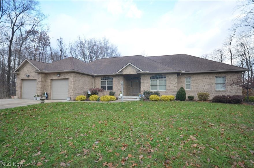 Custom built brick front ranch w handicap features nestled at the dead end of a heavily wooded street. Wide open layout with 9 ft ceilings 6 Panel Solid Oak Doors & trim plus oversized baseboard throughout. Foyer entry leads to massive dining area w tile floor & wall of windows plus a beautiful atrium door to access the massive composite deck overlooking wooded neighboring property.  Giant kitchen w granite counters, tile backsplash, sprawling island and raised panel KraftMaid cabinets & custom oak hood over the range. The spacious & open main living area includes a great rm w nice windows for daylight. 1st flr ½ bth w tile flr & pedestal sink plus a massive laundry room w tile floor-so big it has a 2nd full kitchen plus a door to the deck making this a great space to prep meals for outdoor dining or large gatherings. Giant full bth w 2 sink vanity & tons of cabinets plus a shower/tub. Spacious bedrooms plus a master suite w double door master bath, lg 2 sink vanity, walk in closet, ga