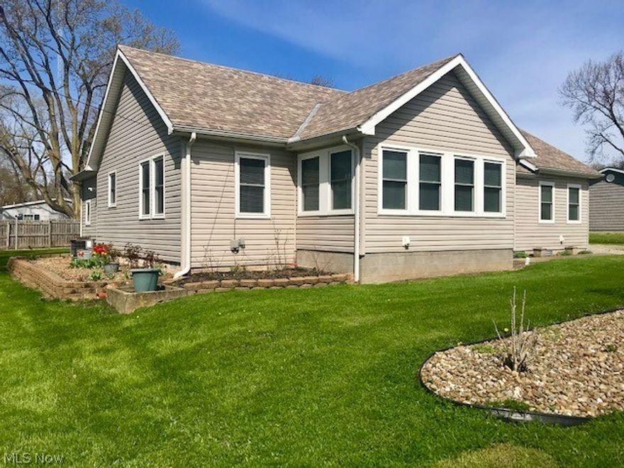 This home offers lovely vintage charm, a large manicured yard, beach rights, dockage rights as part of the Avalon on the Bay subdivision, and is in close proximity of many popular Marblehead/Lakeside destinations! There are 3 lots included in this sale - enjoy the green space! The kitchen is roomy and offers plenty of storage space and comfortable dining area. There is original woodwork throughout the home! This could be the perfect year-round home or summer retreat!