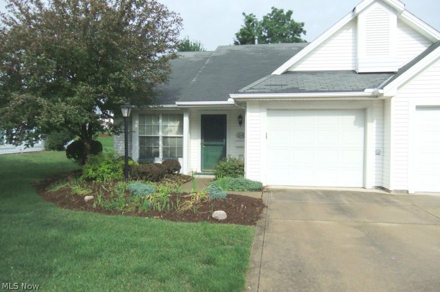 Move in Ready - One floor living with 1st floor laundry attached garage with attic storage in a 55 plus community! Enjoy all the advantages of no snow shoveling or grass mowing! Low monthly fee, neutral decor with newer hot water tank 2 full baths, 9' ceilings great room and low monthly fees. Enjoy coffee on the covered sun room close to shopping! Development includes clubhouse and subdivision ponds with at least 80% of home must be 55 and over. Not a condominium.  Located close to lake and across street from mail boxes.  Features laminated floors in kitchen, foyer with ceramic title in both bathrooms and includes appliances!