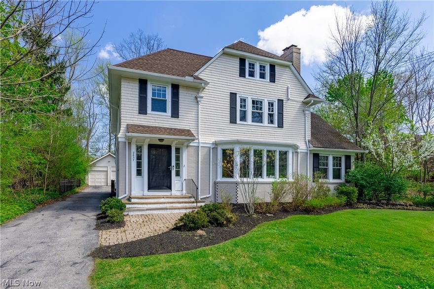Welcome home to 2637 Wellington Road! This thoughtfully updated and well-maintained gem near the heart of Cleveland Heights is the ONE you’ve been waiting for! Step inside to a welcoming interior and flexible floorplan designed to suit a variety of lifestyles. The inviting entryway makes a lasting impression with a stunning staircase and arched doorway that highlight the home’s timeless character. Gleaming hardwood floors add warmth throughout. The living room features an original bay window that fills the space with natural light, along with a cozy wood-burning fireplace. A bright bonus room offers ideal flex space for a home office, reading nook, or sunroom. Enjoy the screened-in porch with an adjoining patio. A spacious formal dining room flows into the eat-in kitchen, complete with a center island, breakfast nook, and new refrigerator, dishwasher, and microwave, providing the perfect foundation to bring your dream kitchen to life! Upstairs, the primary bedroom offers a comfortable retreat with ensuite bath, sizable closets, and an adjoining bedroom. Two additional bedrooms and second full bath complete the level, along with ample storage including a built-in linen cupboard & drawers. The finished third floor adds a 5th bedroom, bonus room, and full bath. The unfinished basement includes laundry and additional storage or hobby space. Outside, enjoy a fully fenced backyard and a two-car detached garage. Notable updates include new windows (2021), boiler (2022), and added AC via mini split and heat pump (2022), plus a 240v plug for EV charging. A 1-year Cinch home warranty is included and the home will be point-of-sale compliant. Located in a vibrant neighborhood near Shaker Lakes, parks, Lee Road dining & shopping with easy access to University Circle, Cleveland's world class hospitals and health systems, downtown & beyond. This is a fantastic opportunity to own a move-in-ready home that combines timeless appeal, thoughtful upgrades, and so much potential!