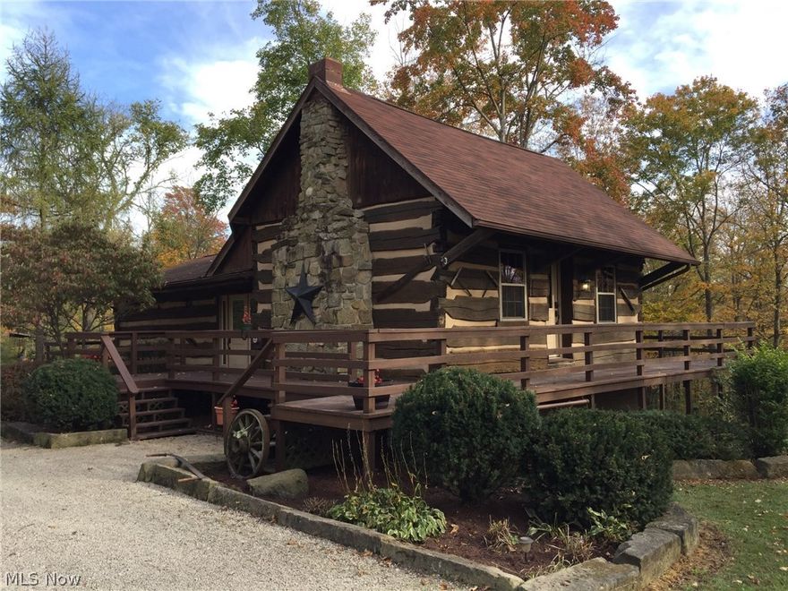 Peace & Quiet surround this beautifully secluded two bedroom log cabin nestled back a gated private drive. Enjoy the character and craftsmanship throughout the primarily open entry level & 1/2 story loft. Absolutely beautiful from the bamboo flooring to the efficient & spacious kitchen pantry/dining area cabinetry. Privacy abounds in this primarily wooded area including a pond. A finished apartment loft above the two car garage offers extra space and privacy for the occasional guest. Additional 3 car garage makes a great place to store tools for maintaining the property and toys for riding the private trails to enjoy the property. A Must See!