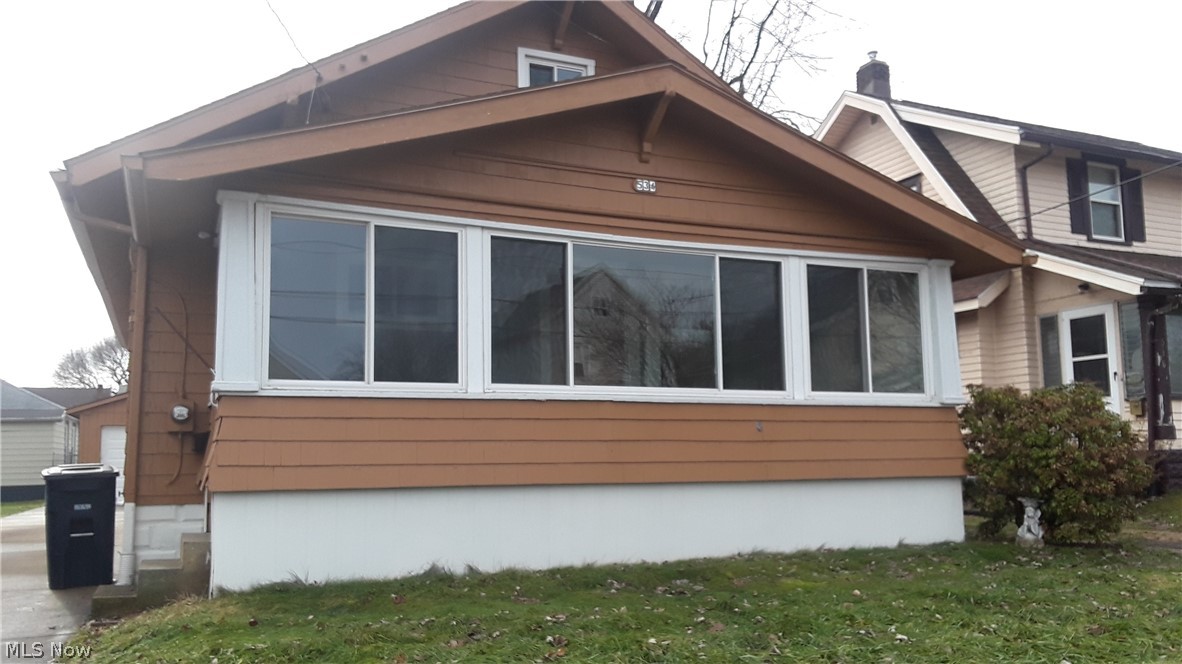 Spacious bungalow home with many amenities. Enclose front porch with lake view, large living room with new flooring, first level bath and bedrooms. Third bedroom on second level, large eat in kitchen with mud room area, semi finished basement with laundry hook ups. Exterior included backyard, car port and garage. Professionally managed, online application fee $25 per adult.