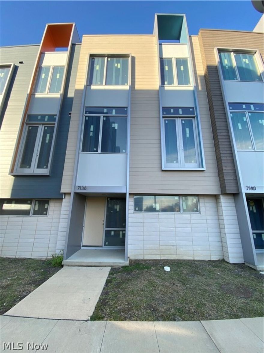 PHASE II ONE MIDTOWN! Cleveland's newest development located in the Health-Tech Corridor. Beautifully designed 3 bedroom, 2.5 bath townhome with tons of natural light. Open floor plan features a large kitchen with island and tons of cabinetry. The living area features a fireplace and large exterior balcony with sliding glass doors. Three bedrooms on 3rd floor with 2 full baths and a rooftop deck with panoramic views of the City! The interior is finely crafted featuring luxurious high-end standards and finishes • Open-concept spacious floorplan • Additional bonus room for office/den or additional bedroom • Hand-scraped engineered wood flooring • Modern kitchen cabinets • Quartz countertops • Stainless steel appliance package • High-efficiency furnace and air conditioning • Modern hardware and fixtures • Smarthome technology—Standard home security and Pre-wired AV home audio system • Attached two-car garage • Rooftop and balcony terraces with panoramic views. This unit is white boxed, buyer can choose materials from generous materials package. AFFORDABLE: 15-Year 100% Tax Abatement—and can qualify up to $30,000 Greater Circle Living Grant (GCL). Amenities include: walk/bike to Dave's Market. Minutes to Downtown Cleveland, Playhouse Square, University Circle and Little Italy. Take the Healthline by bus or bike path to downtown. This is urban living at its finest.