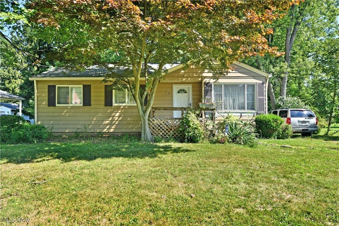 910 W 3rd
Get out your maps, there’s hidden treasures to be found here! Don’t worry, you won’t have
to look too hard as you realize the huge potential found within this cozy Niles residence.
Tucked away beneath the natural veil of a tree lined lot, the three-bedroom home quickly
displays its elevated front porch, and two-car detached garage at the end of the driveway.
The wooded backdrop is a major bounty, stretching out over two acres to find the scenic
Mahoning River included within its property rights. Expand as you wish, blaze a path and
craft a launch for literal backyard access to kayaking, canoeing and more. A second rear
patio overlooks the cleared backyard and its park-like views. Inside, a spacious living room
opens with hardwood flooring and plenty of natural light. Formal dining is just steps away
as decorative lighting and glass block separate the kitchen. Here, an array of warm wood
cabinetry joins stainless appliances for an added touch. A prominent rear family room
continues with hardwood flooring and exposed overhead beams as tall windows highlight
the lush surroundings. A brick mantle tops things off with an inset fireplace. Three sizeable
bedrooms round things out down the main hall, each adjoining the handsome full bath.
Downstairs, plenty of storage joins a bar area, rec space and a lower kitchenette with
laundry service. X marks the spot; Call today for your private showing!
