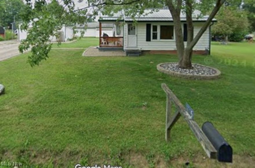 Must see! Pull up to the home and there is a detached large two car garage with electric! The home sits on .14 acres in Marlington local schools! Many updates! Walking into the front door you are in the open concept kitchen/dining room. Floors redone in 2024! New stove in 2025, fridge in 2020! Cabinets and trim was painted in 2024. In the living room is a wood burning fireplace (seller's have not used it) nicely sized with carpeted floors. Down the hallway the floors were also redone in 2024, the bathroom is the first door on the left. It has a nice walk in shower that was remodeled in 2023! The master bedroom has access to the main bathroom. Off the master bedroom it is a nice size and then it has its own access outside. The other two bedroom are a nice size with carpeted floors. Down in the basement is it dry! Laundry is at the bottom of the stairs, other side is open for storage or possibilities to finish it off and add some living space, circling back around there is a full bathroom that needs a little TLC to bring it to its former glory! Other updates include metal roof, downspouts and gutters in 2018, hot water tank 2021, stove 2025, fridge 2020, floors 2024, doors and windows 2024, shower 2023 and some pex and pvc plumbing done. ALL YOU NEED TO DO IS MOVE IN!