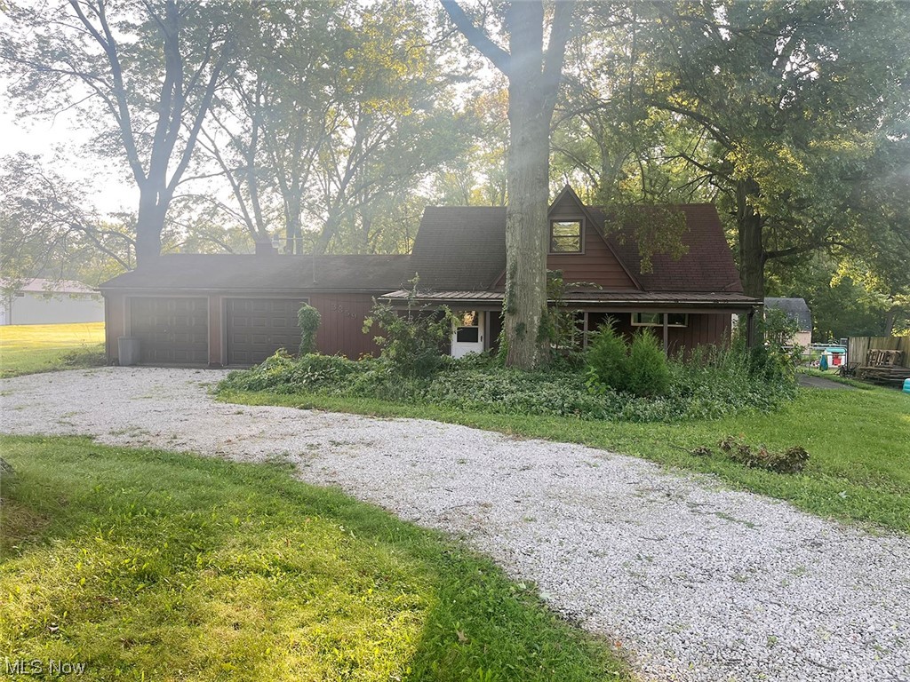 3 bedrooms, 1.5 bath home on 1.23 wooded acres. Home features include kitchen, first-floor laundry, living room, 2 car garage, and covered front and back porches. Well water and public sewer.