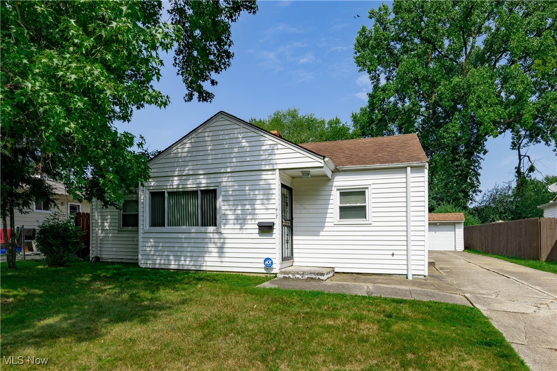 This charming and cozy 2-bedroom ranch is the ideal choice for those just starting out or looking to downsize. With everything on one level and a manageable footprint, this home offers the ease of maintenance that makes it a fantastic alternative to condo living—without the HOA fees! Tucked away in a quiet neighborhood, this home features natural light thanks to large windows that brighten every corner. The bedrooms are thoughtfully positioned on opposite sides of a centrally located full bathroom, providing privacy and comfort. Each bedroom is a peaceful retreat, complete with carpeting and generous closet space. The kitchen is compact yet highly functional, boasting wooden cabinets and modern appliances. Step outside to a spacious wooden patio—ideal for morning coffee or evening get-togethers. The almost fully fenced backyard offers privacy and space to relax or entertain on the deck. Whether you're a first-time buyer or looking to simplify your lifestyle, this low-maintenance ranch home is a must-see!