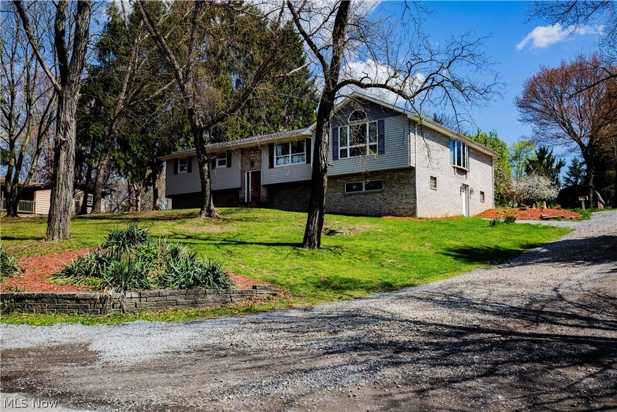 Very spacious rooms in this rambling raised ranch with split level entry located in the country on a corner lot.  Additional lot behind for more elbow room.  You will be amazed at the spaciousness and large rooms with a comfortable flow throughout.  3 beds, 2 baths, laundry, office, kitchen, breakfast/morning room, formal dining, great room, and living room all on main level.  Possible 4th bedroom in basement with large storage area, huge utility room could be finished for more space, large rec room with fireplace, and huge workshop area, which could also be finished for more space.  1.8 acres between the 2 lots of nice laying land. Per neighbor, Frontier business internet allows them to work from home with no issues.